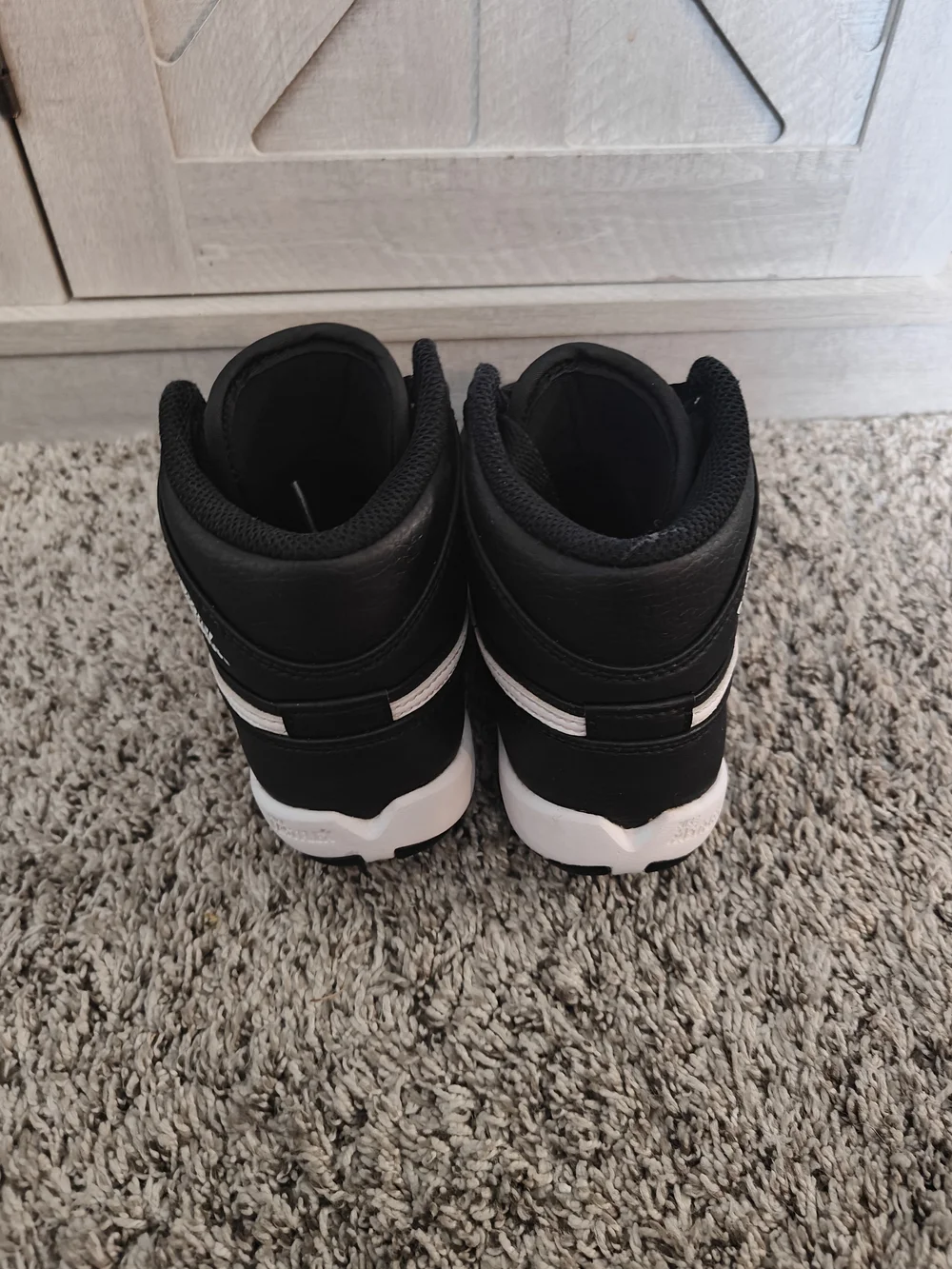Jordan 1 Mid Toddler Cleats in a Black and White Colorway 13c